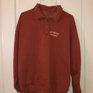 RARE brandy melville orange archer sweatshirt